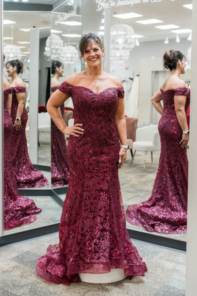 Photo of the model wearing a Mothers Collection gown